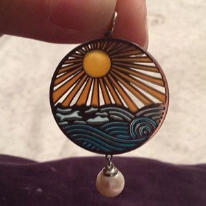 Pearl necklace sun and ocean scene